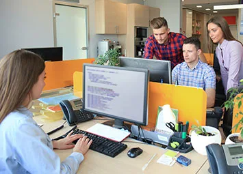 iSystems360 team collaborating in a modern office